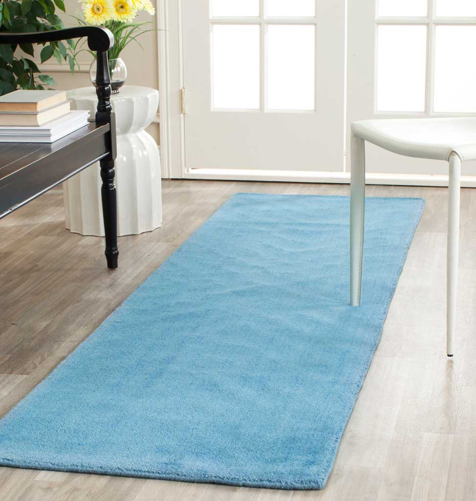 Blue runner brings a calm pop of color to a bright, open space.