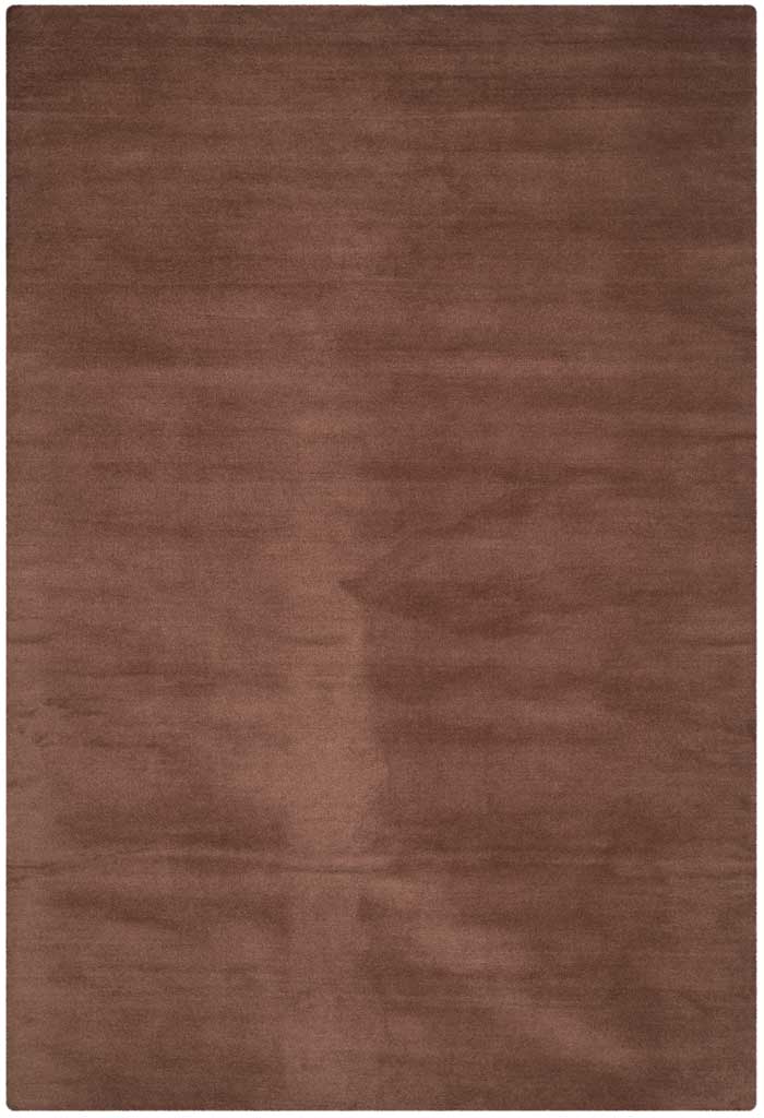 Warm brown area rug shows gentle tonal movement through its velvety hand-tufted pile