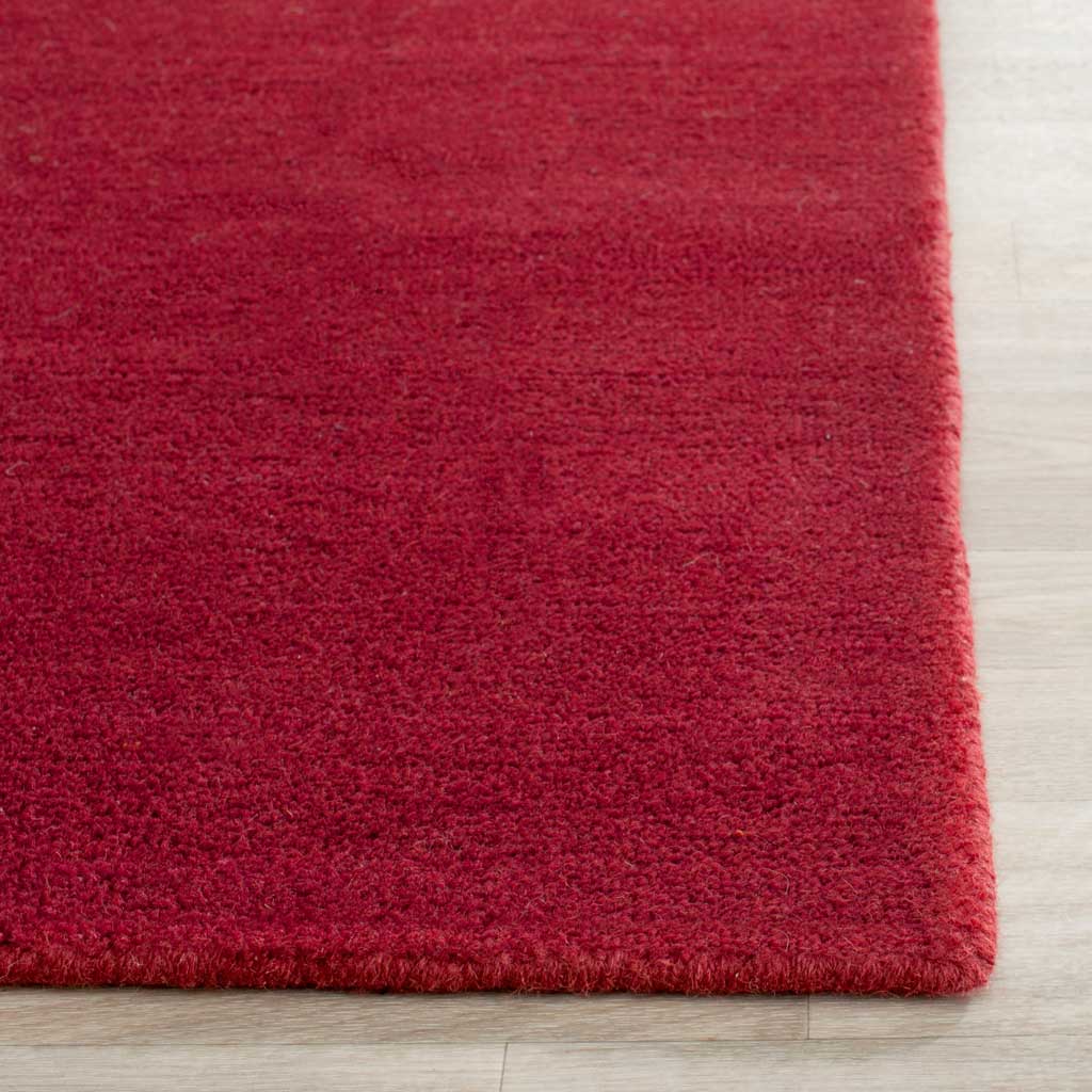 Bright red, plush-looking pile extends to the runner's carefully finished edges.