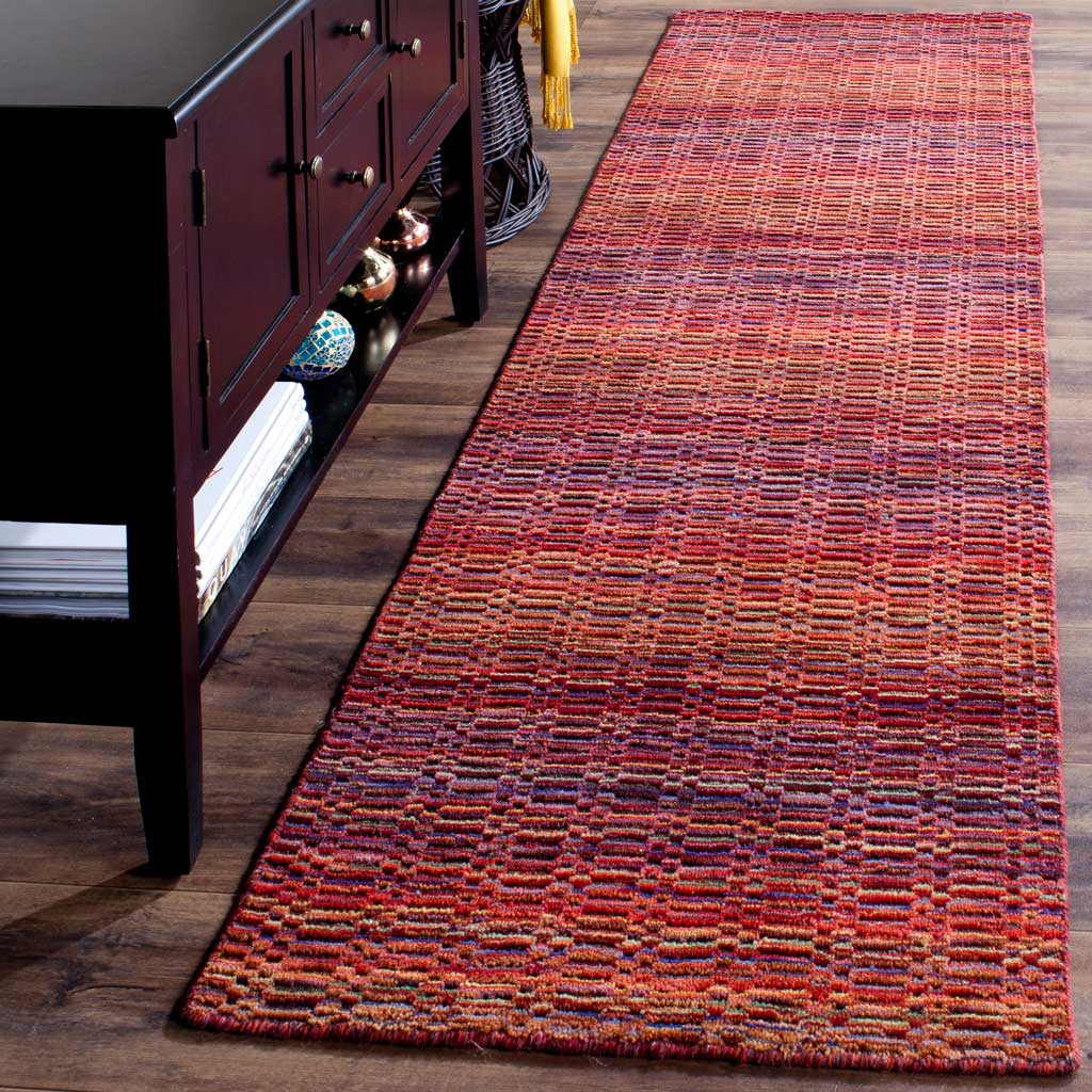 Textured wool runner blends vibrant red, orange, and purple threads in an inviting striped design
