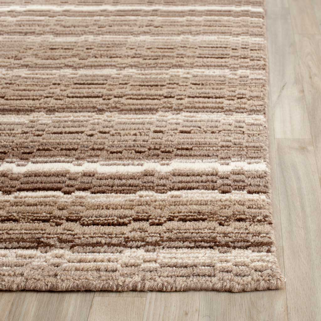 Warm neutral wool stripes meet a neatly finished edge with a soft, dimensional pile