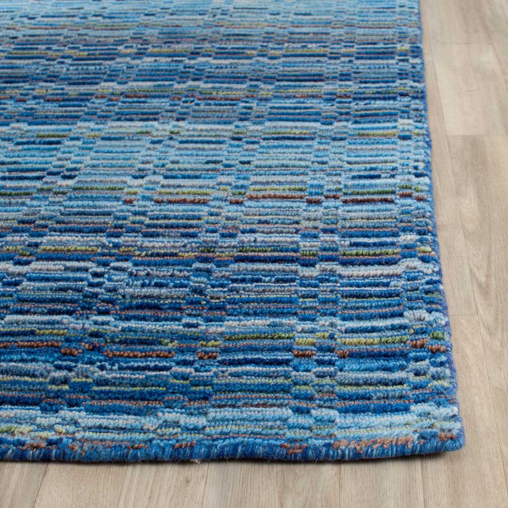 Textured blue wool stripes and warm flecks extend to a neatly finished corner