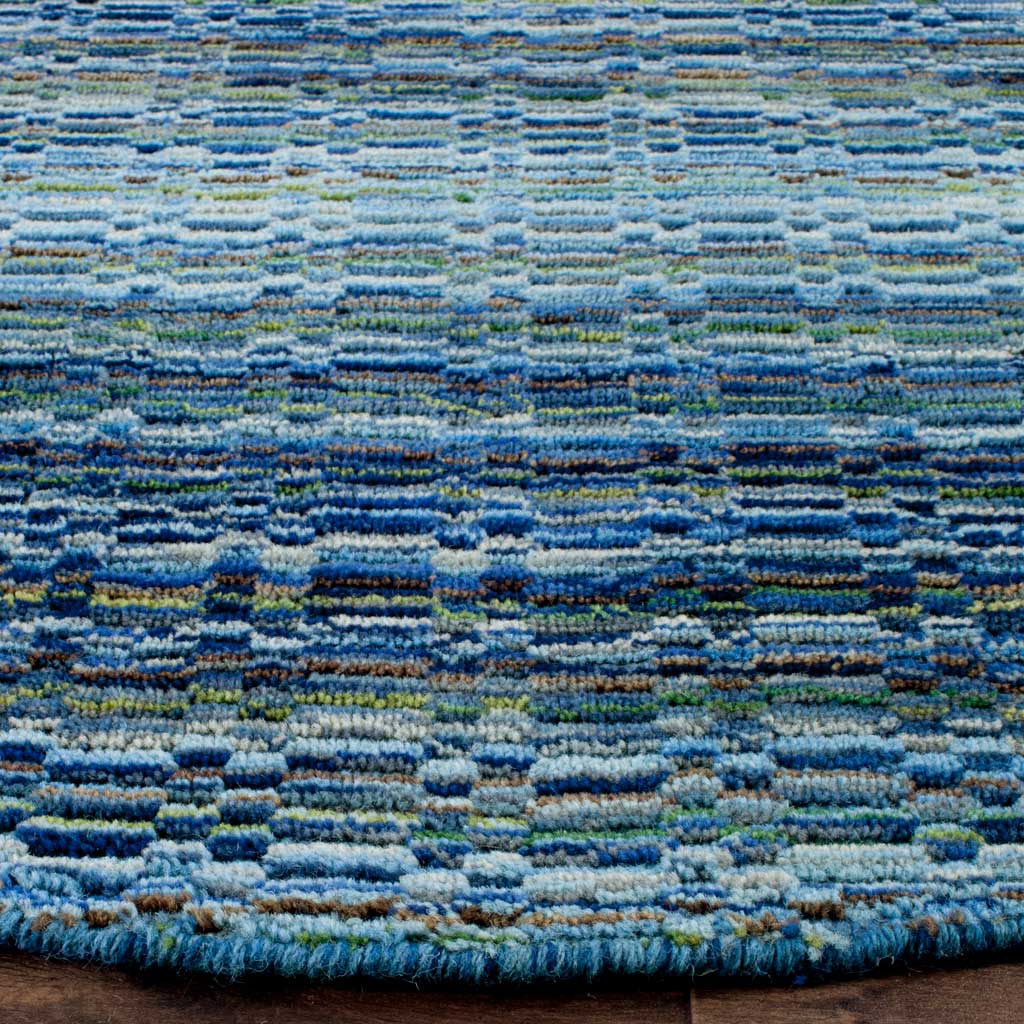 Textured wool stripes in layered blues meet a neatly finished rounded edge