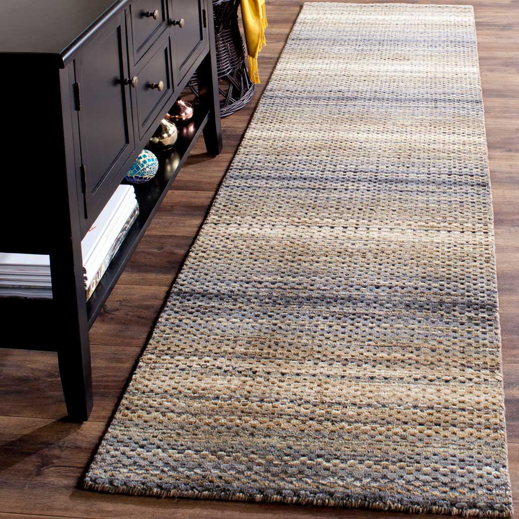A textured wool runner in soft gray and beige tones adds warmth to narrow spaces