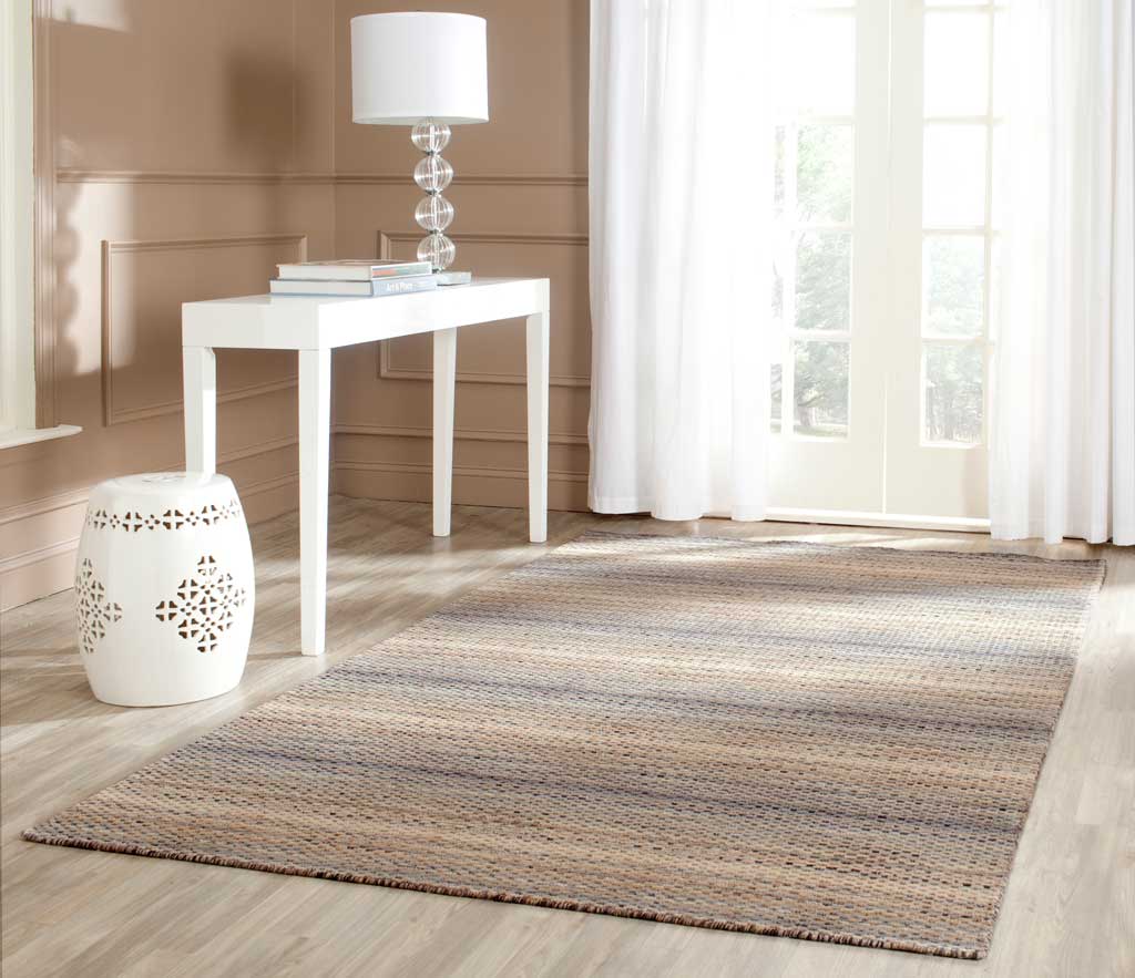 Soft gray and warm beige stripes bring understated texture to a bright room