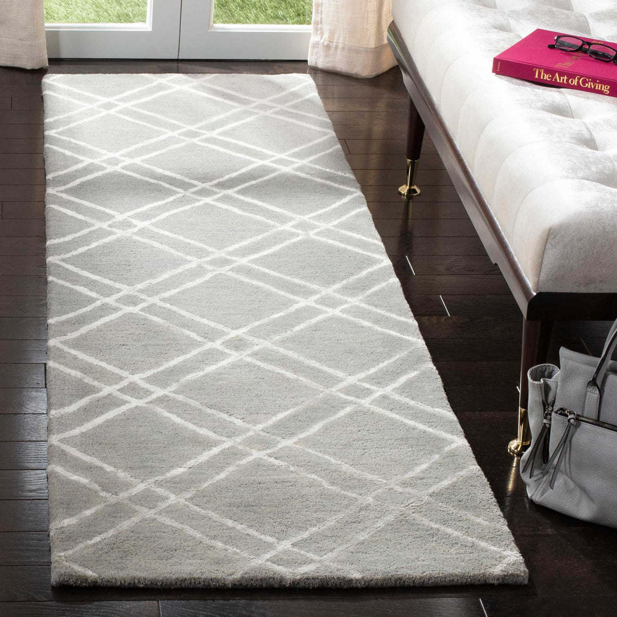 Plush gray runner with slender silver lines that add geometric contrast