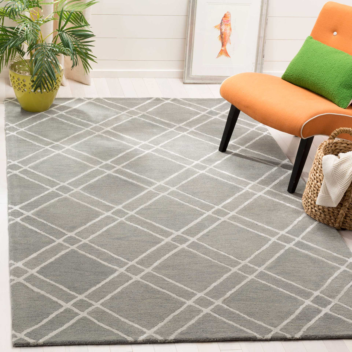 Soft gray and silver lattice rug brings understated geometry to a bright space