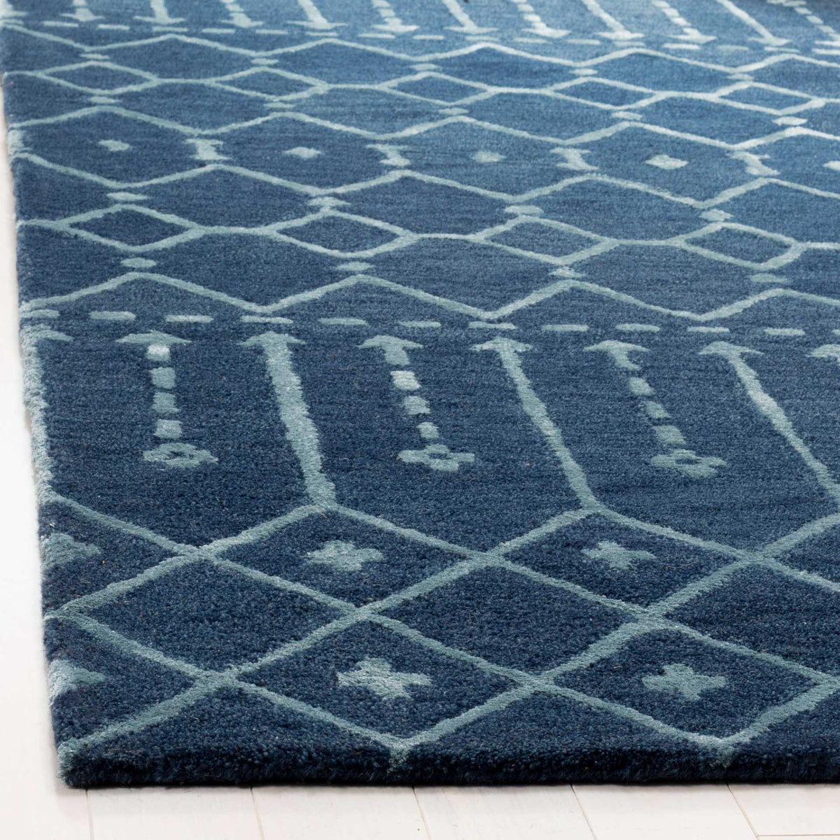 Plush navy wool pile with silver diamond motifs and a neatly finished edge