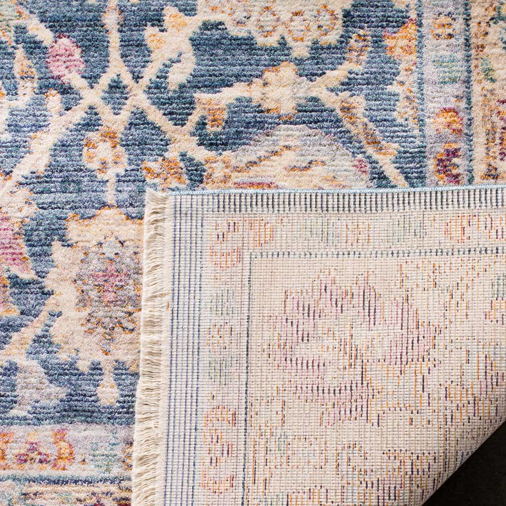 A folded corner reveals the woven backing beneath a blue and cream floral surface
