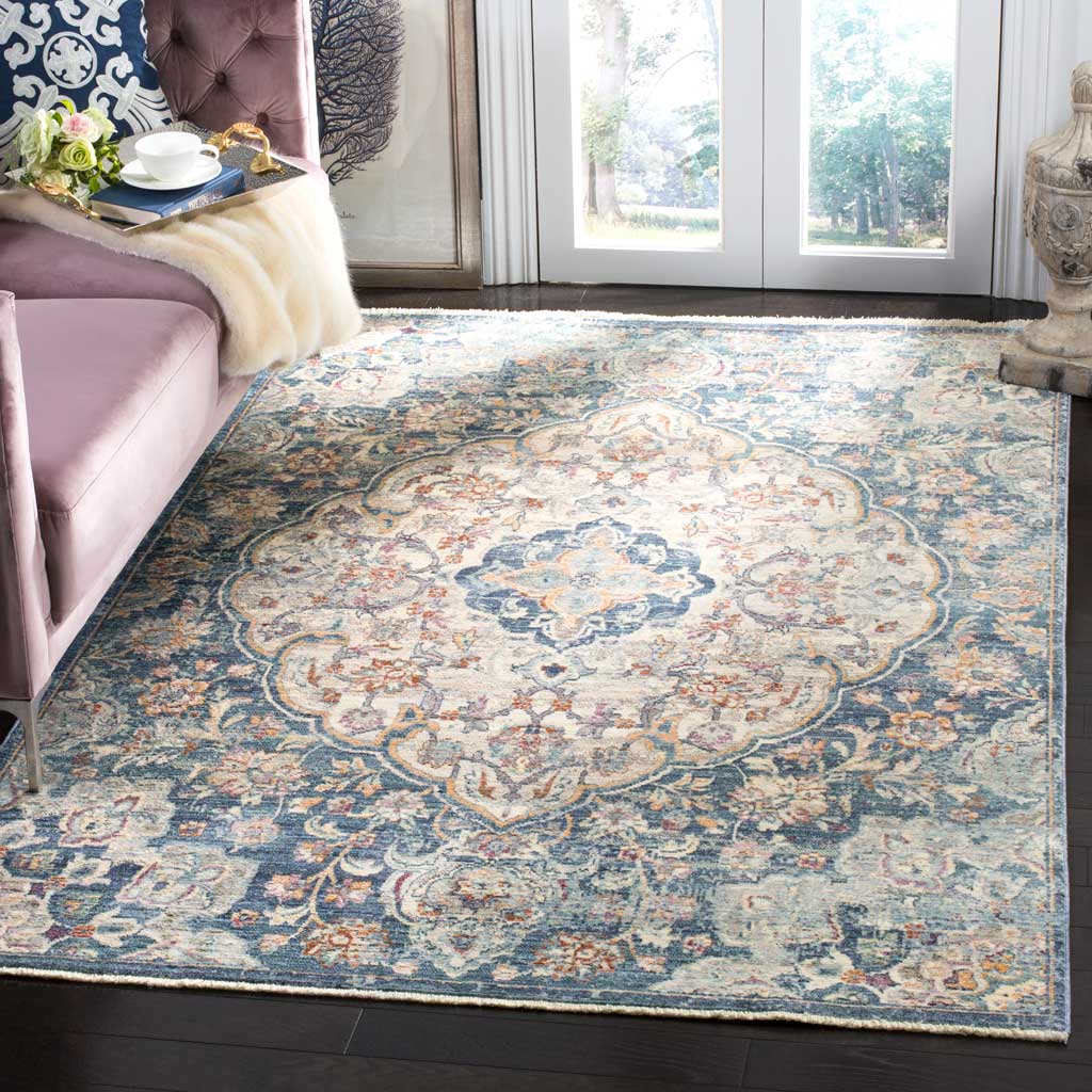 An ornate cream and blue medallion rug brings vintage-inspired detail to a bright living room.