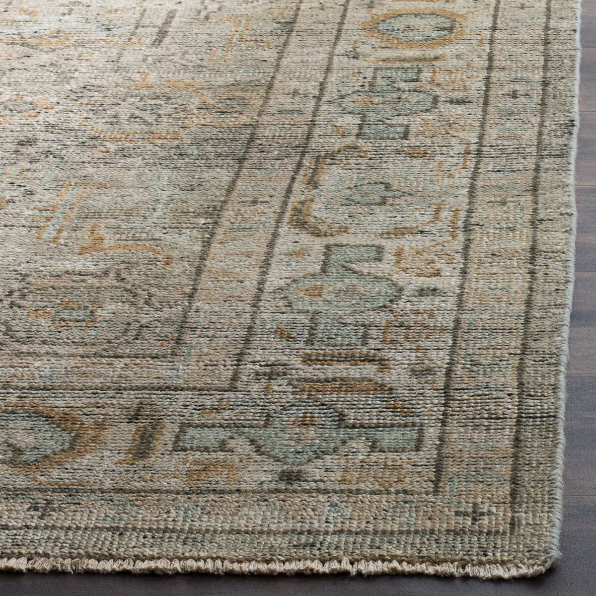 A neatly finished edge highlights the wool texture and faded teal border motifs