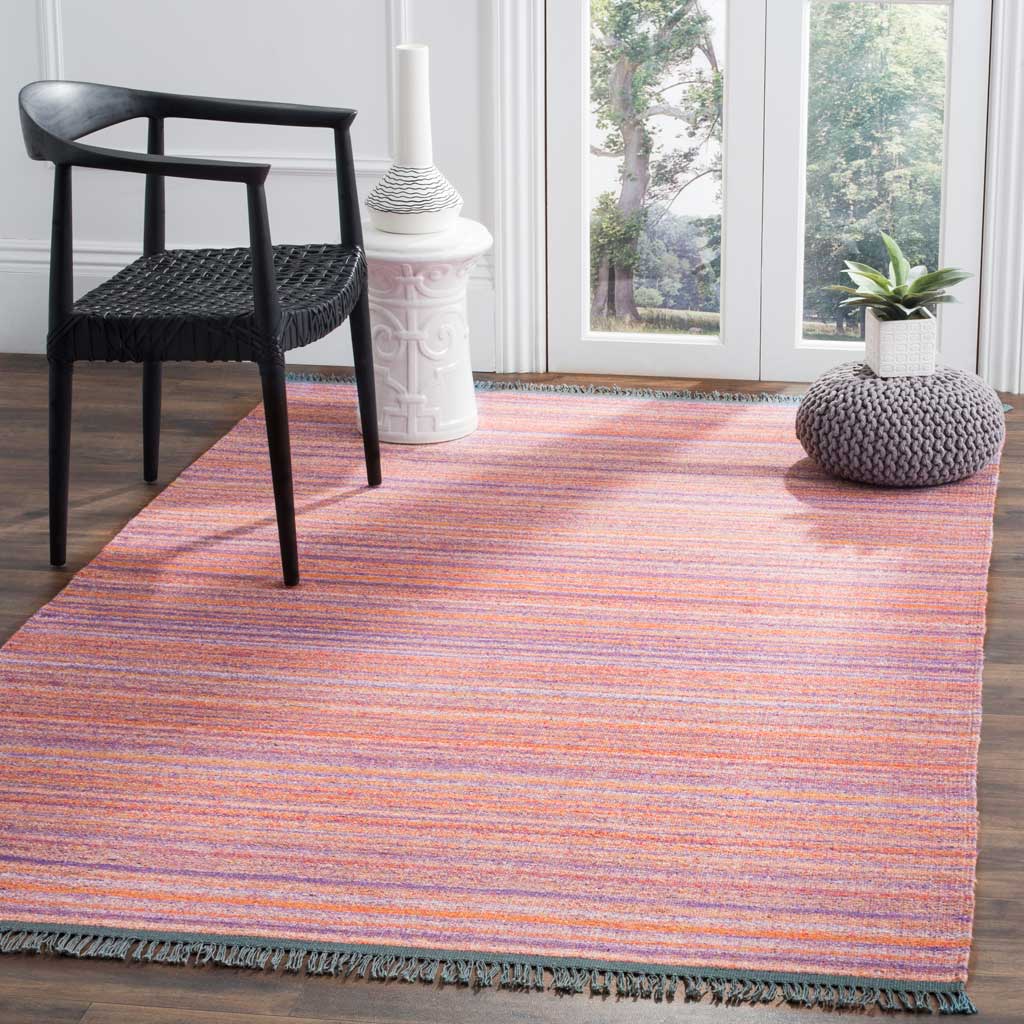 Soft purple and warm rust stripes bring inviting color underfoot, finished with blue-gray fringe
