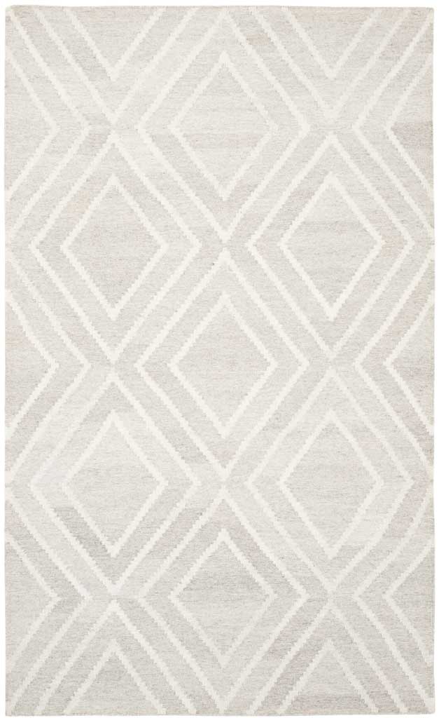 Soft ivory rug with oversized tonal diamonds and a gently textured surface