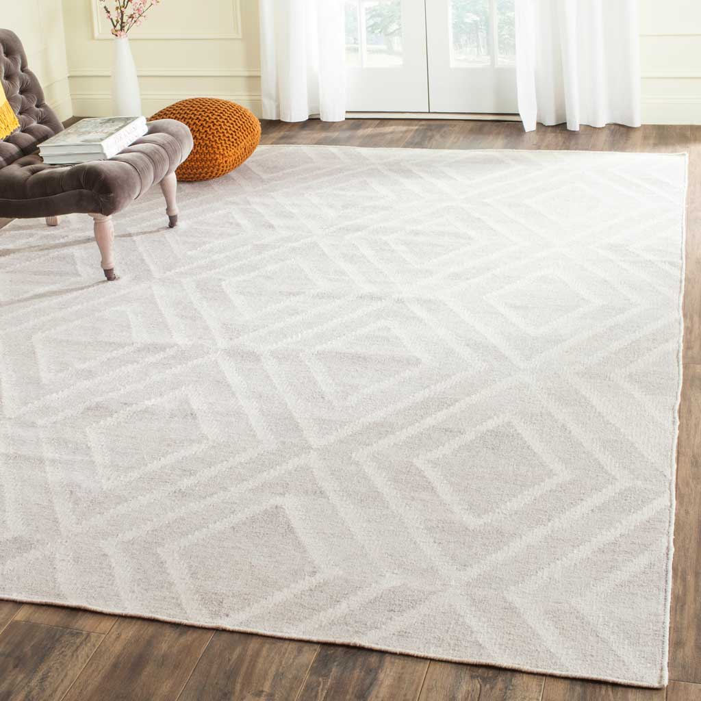 Tonal ivory diamond rug lends understated texture to a light-filled room