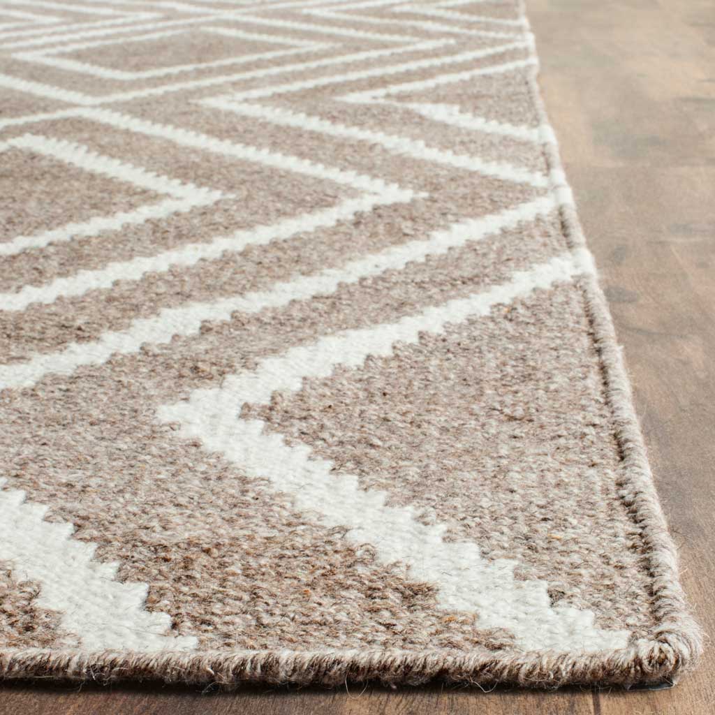 Textured gray and ivory rug with angular lines and neatly finished edges