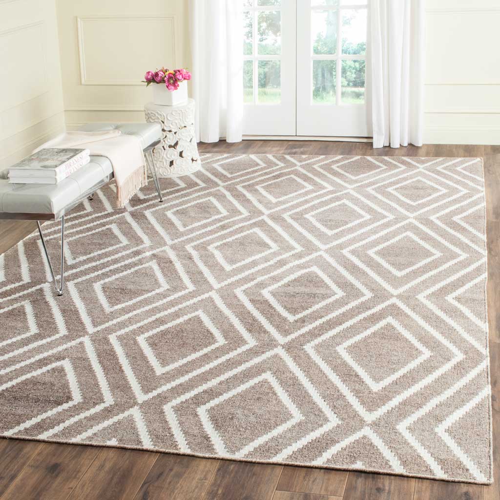 Gray and ivory diamond rug brings clean, graphic lines to a bright living space