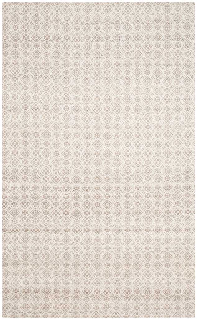 Subtle gray and ivory medallions create an intricate allover pattern on this handwoven wool rug