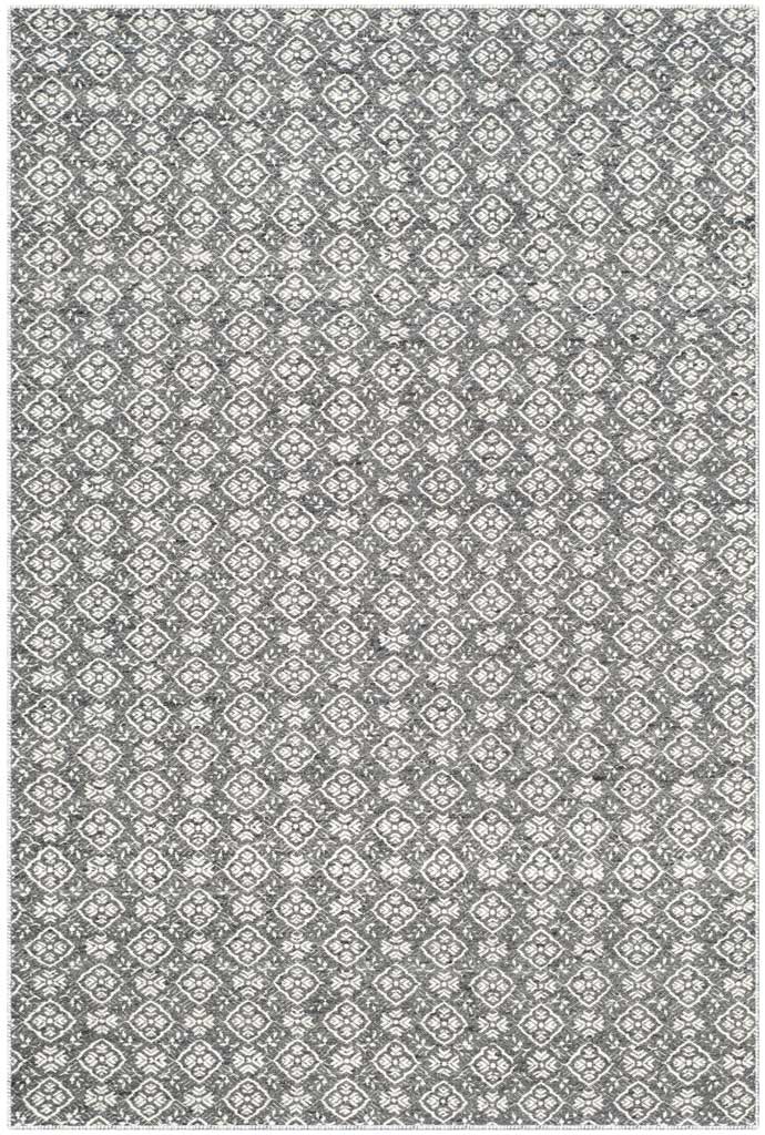 Handwoven charcoal wool and crisp ivory medallions make a richly detailed geometric rug