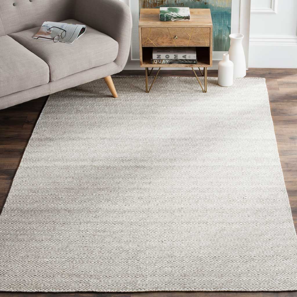 Ivory and graphite wool rug adds a soft geometric pattern and gentle contrast beneath furnishings