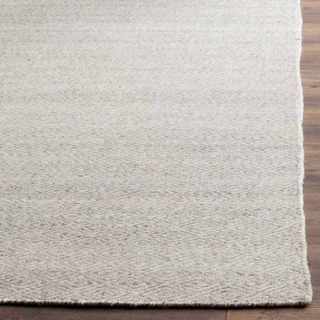 Ivory and silver wool weave shows faint diamonds and a clean, finished edge