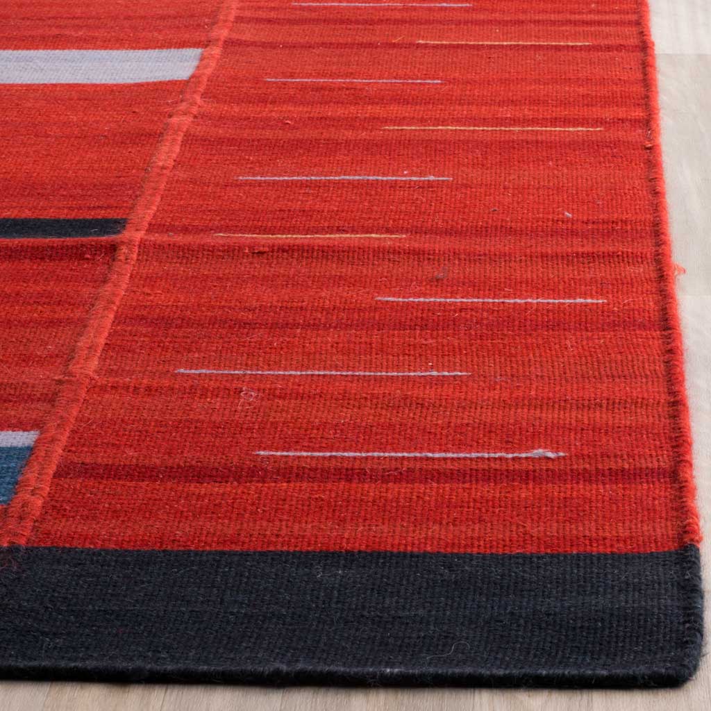Rich red wool weave shows fine pale stripes and a neatly finished black border