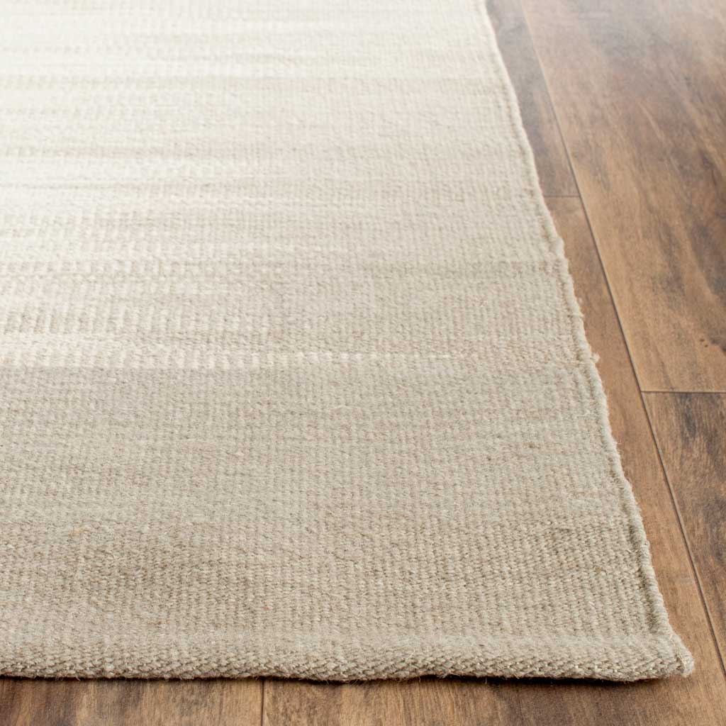 Soft beige wool weave meets a neatly finished edge for a refined, low-profile feel