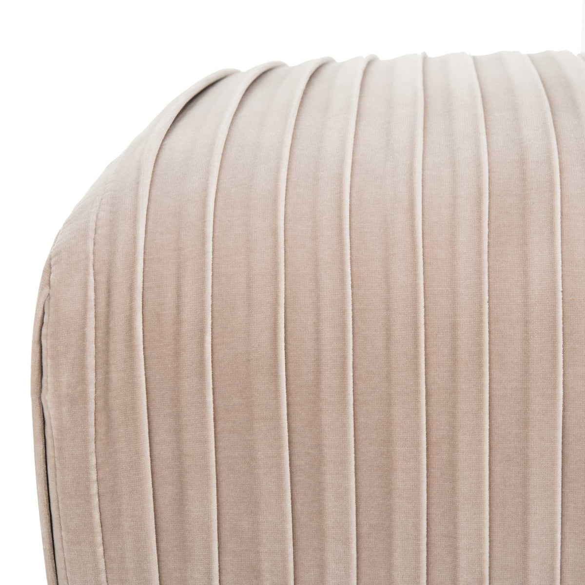 Plush almond velvet pleats follow the bench's rounded edge for a soft, tailored look