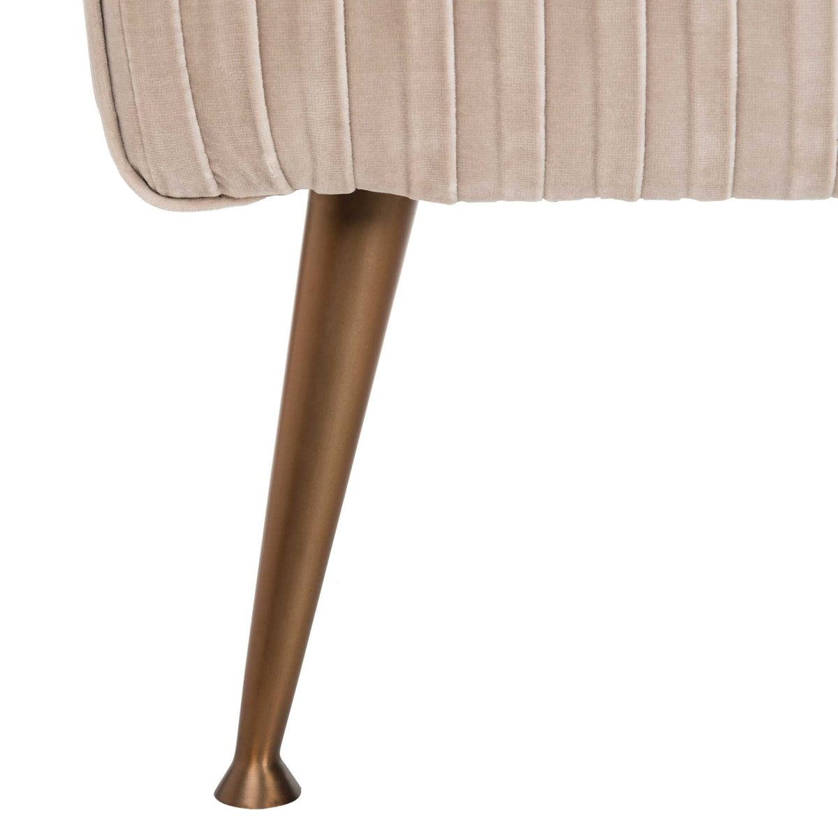 A slender antique brass-finish leg adds warm contrast to pleated almond velvet