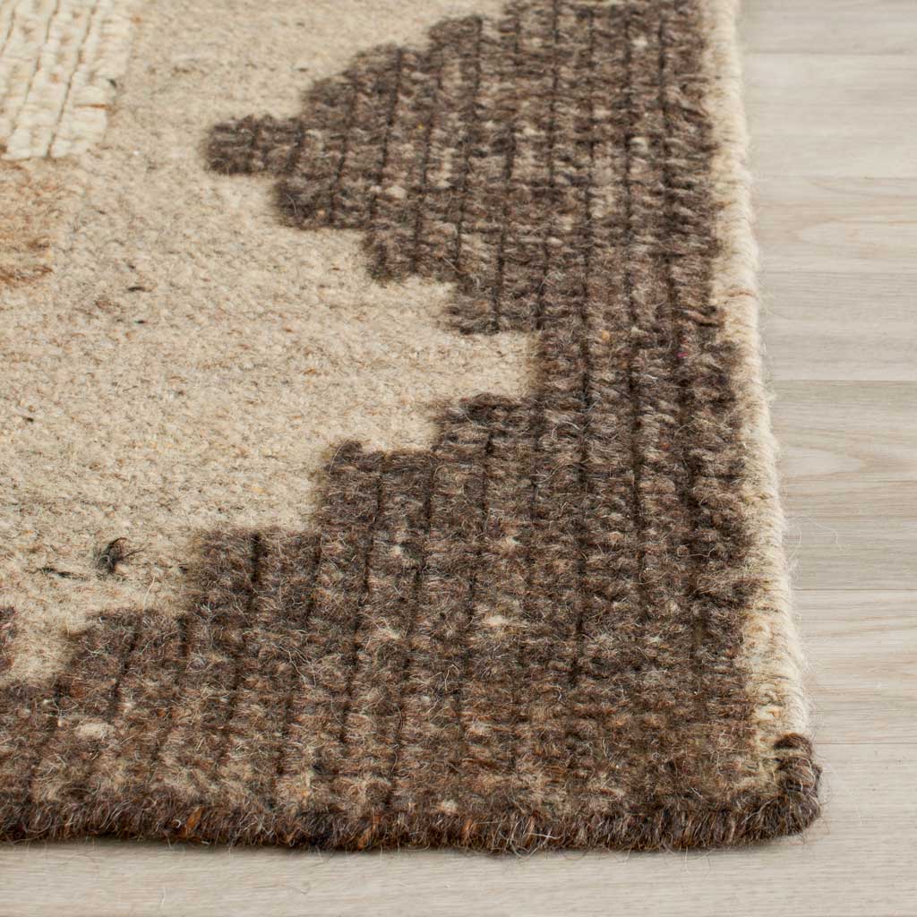 Textured brown and cream yarns define the rug's geometric edge