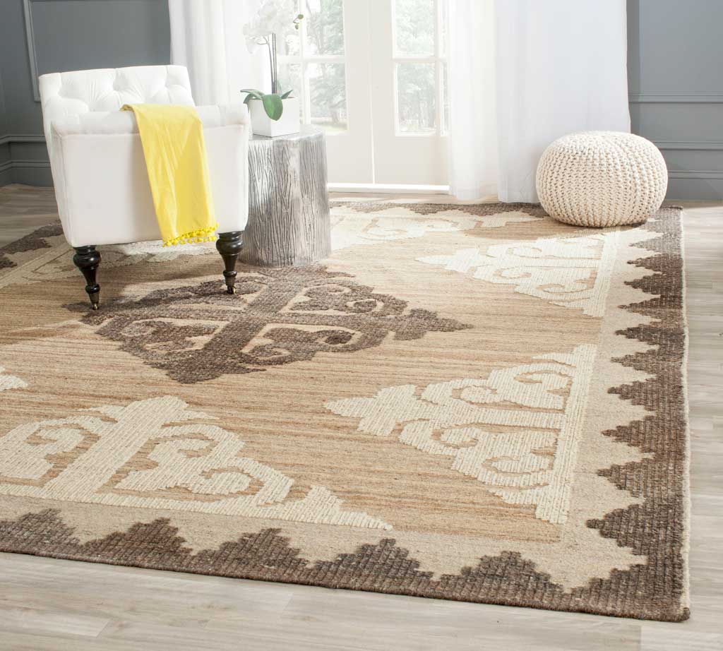 A warm brown rug with a charcoal medallion and ivory scrolls adds pattern to a seating area