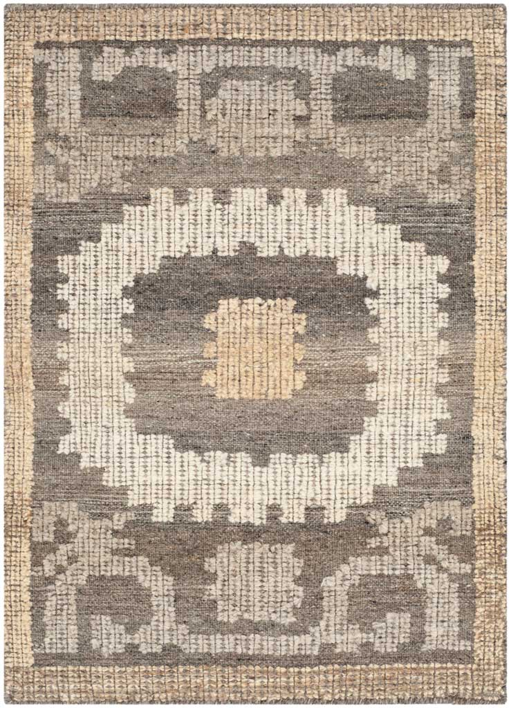 Ivory and brown accent rug with a tan-centered medallion, symmetrical motifs and a tan border