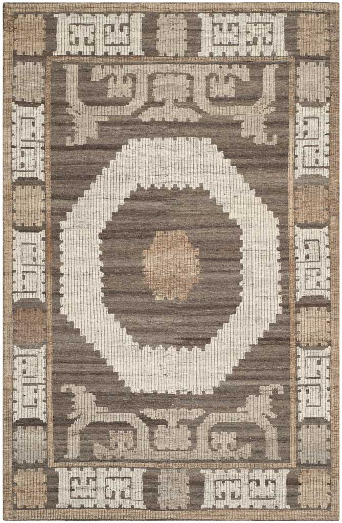 An ivory octagonal medallion and tan center stand out against a brown field with ornate scrollwork