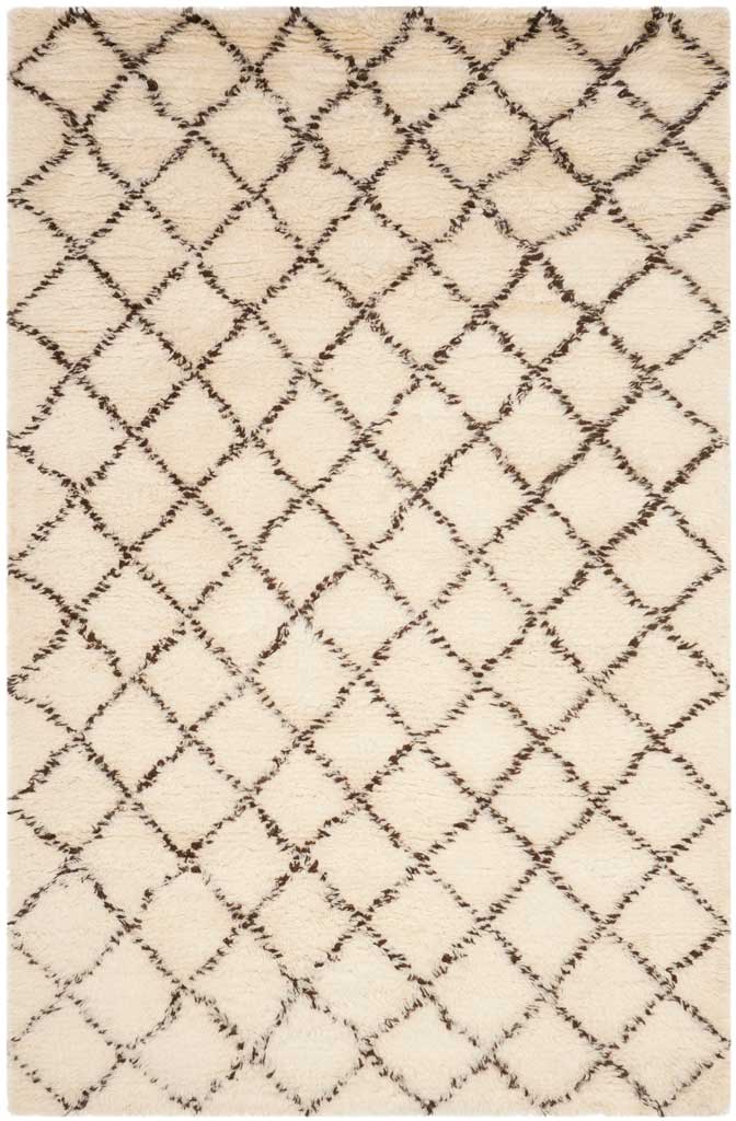 Creamy ivory rug patterned with irregular dark brown diamonds