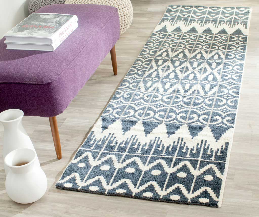 Charcoal and ivory runner brings bold geometric pattern to a bright seating area