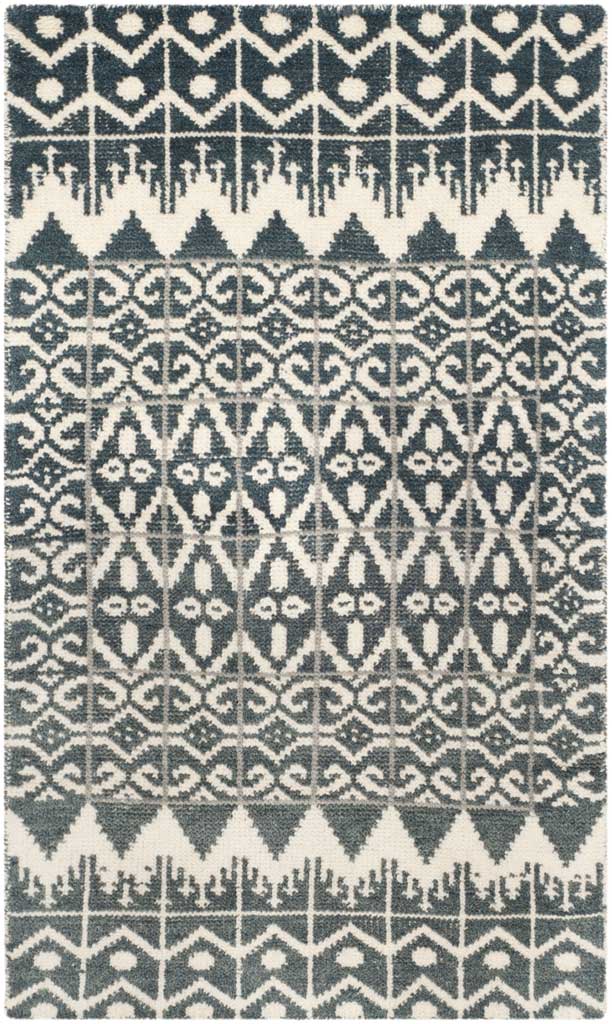A charcoal and ivory area rug blends repeating diamond shapes with intricate scrollwork and graphic bands