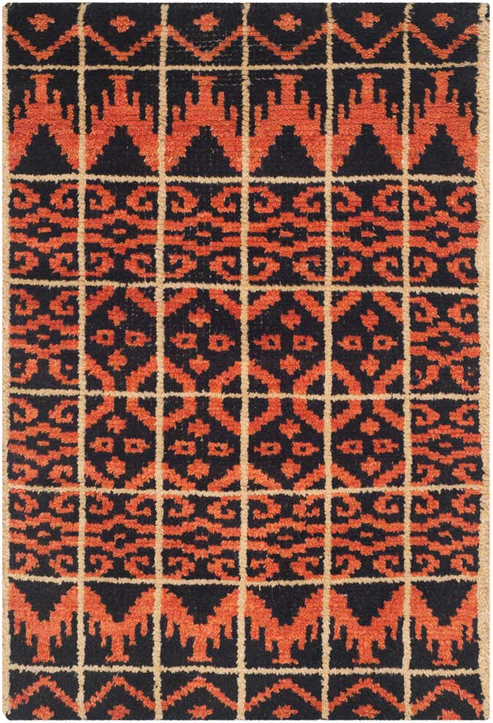A small black accent rug packs orange diamonds, scrolling motifs, and bold triangular borders.