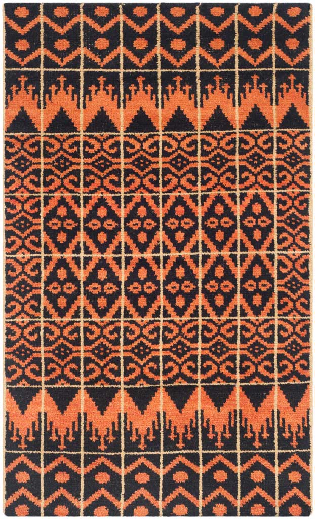 Orange diamonds, scrolling details, and zigzag borders enliven a compact black area rug.