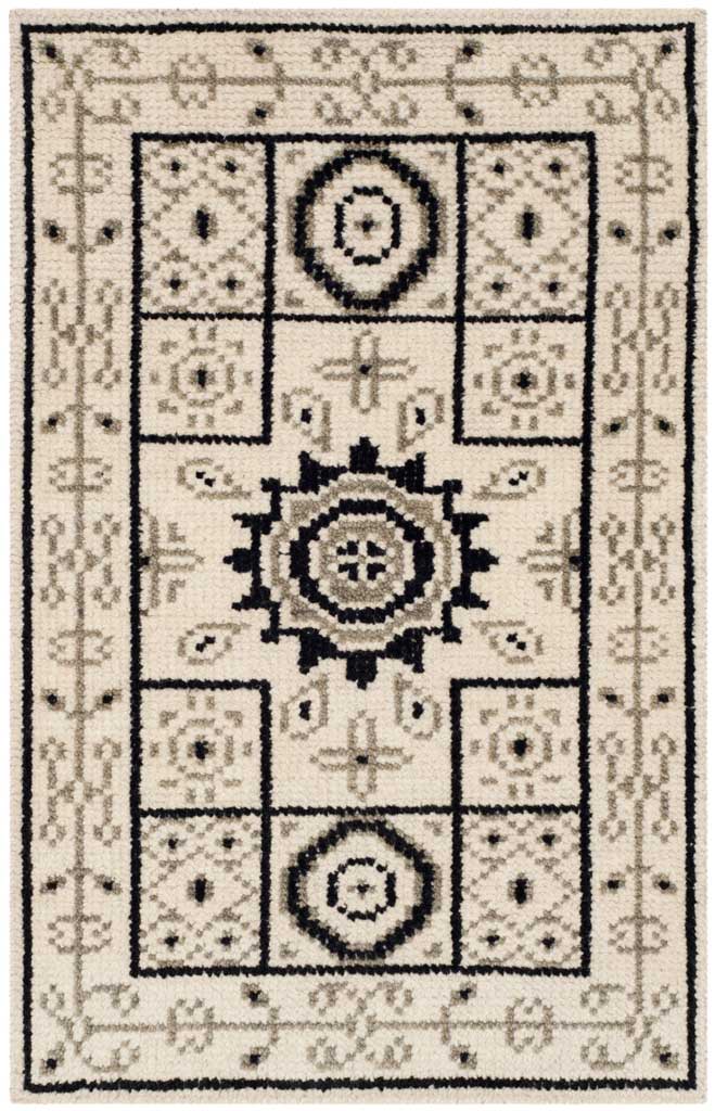 Compact ivory and gray accent rug with dark medallions and a delicate patterned border