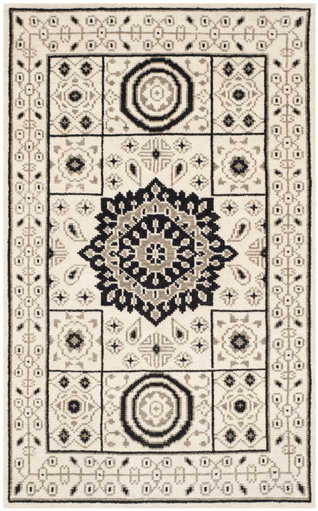 Rectangular ivory and gray rug with a prominent central medallion and intricate ornamental borders