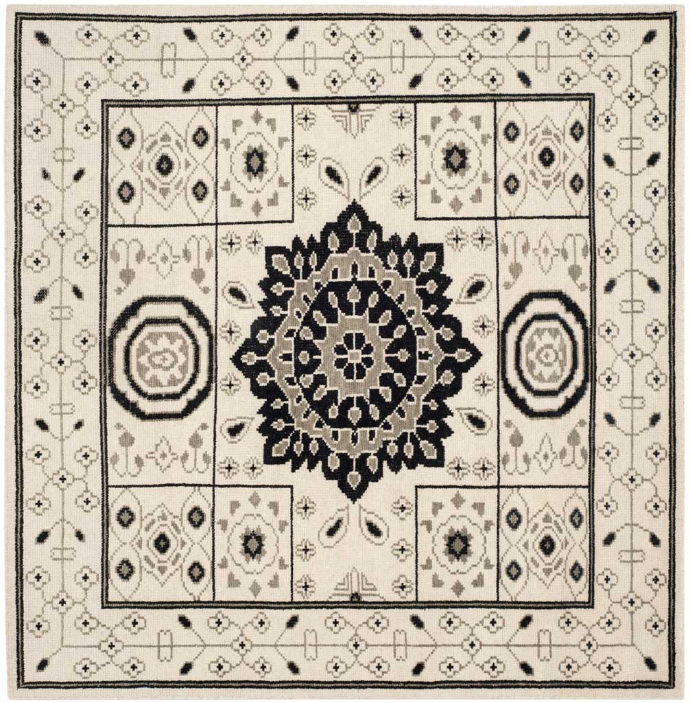 Square ivory and gray rug with an ornate central medallion and symmetrical geometric motifs