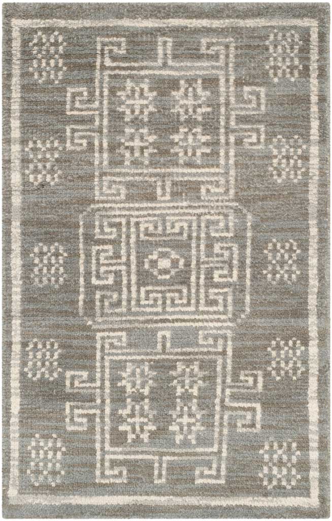 Compact gray accent rug with three stacked ivory geometric motifs and a simple border