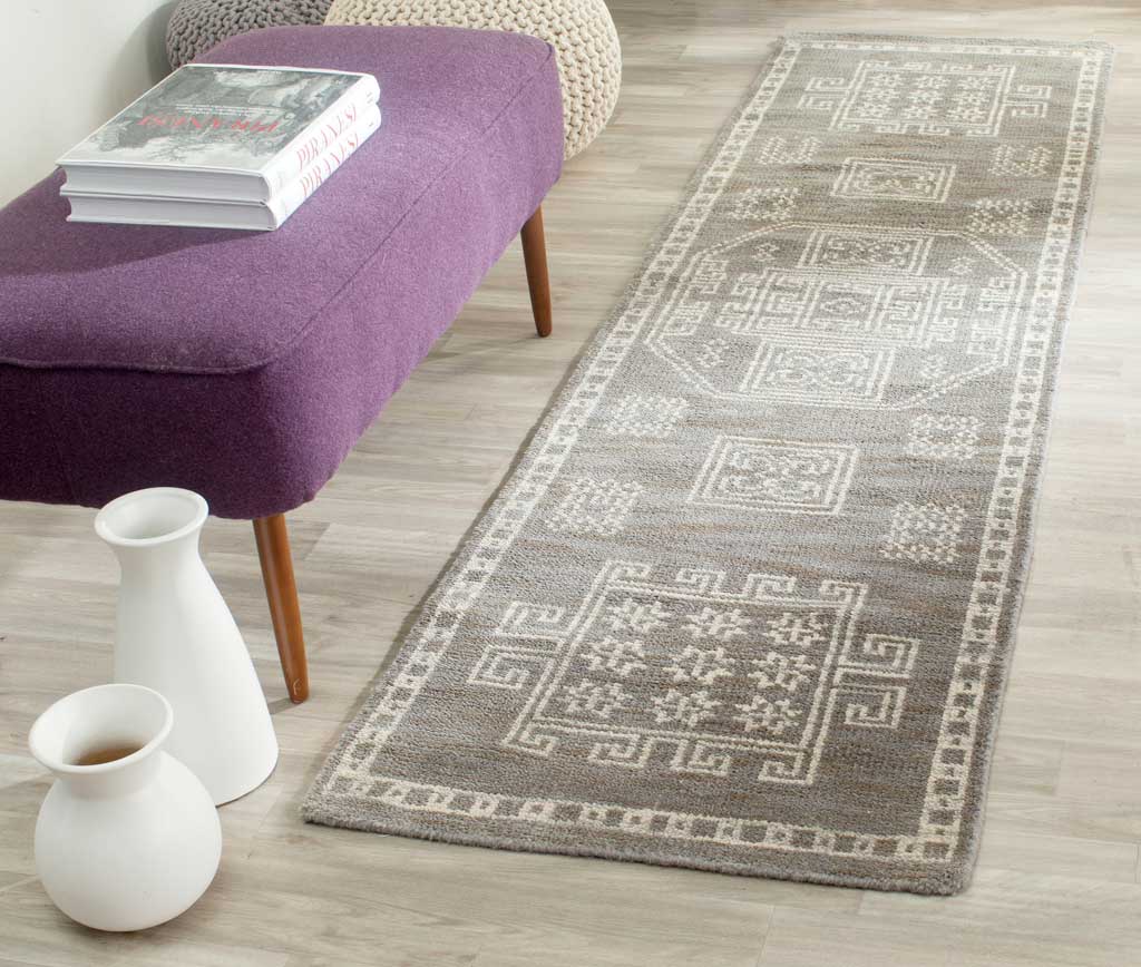 A softly textured gray runner with ivory motifs brings timeless style to narrow spaces