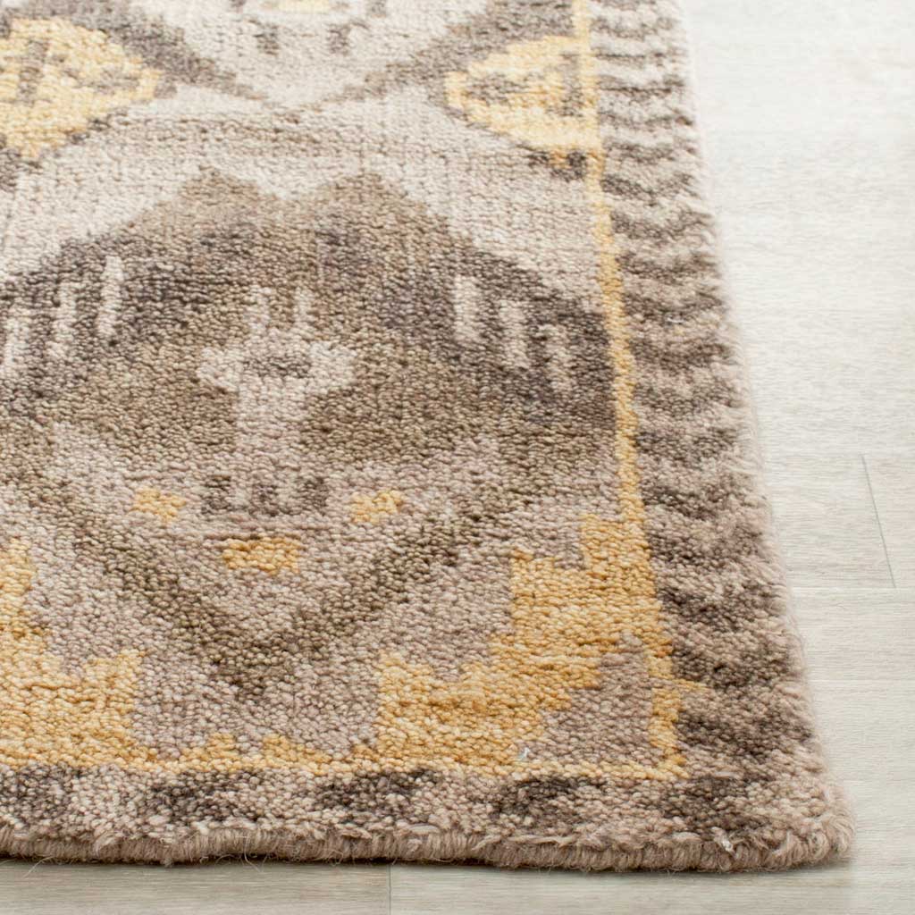 Textured gold and beige pile meets a neatly finished rug corner