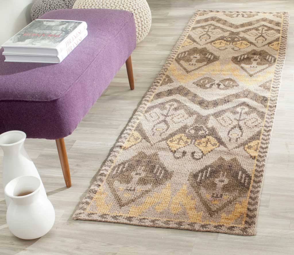 Gold and beige geometric runner adds warmth and pattern to a bright living space
