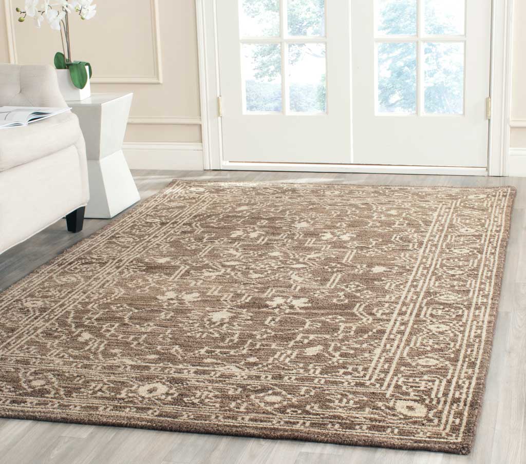 Brown and beige medallion rug adds warmth and intricate pattern to a light-filled living space