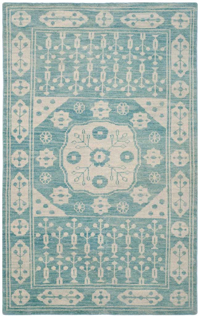 A softly distressed blue rug centers an ivory medallion among intricate traditional motifs.