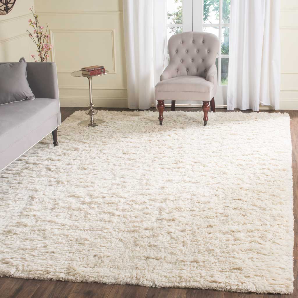 Lush ivory shag creates a bright, inviting foundation for living room furniture