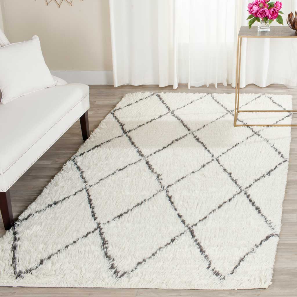 Plush ivory pile and gray diamond lines bring cozy contrast to a bright living space