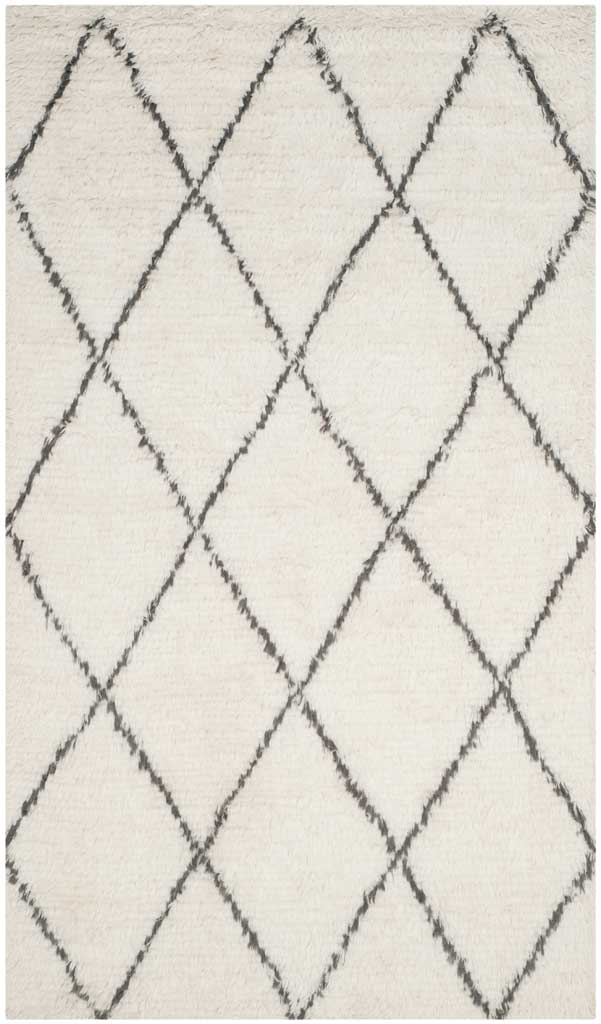 Ivory rug with elongated gray diamonds and a soft, lofty pile