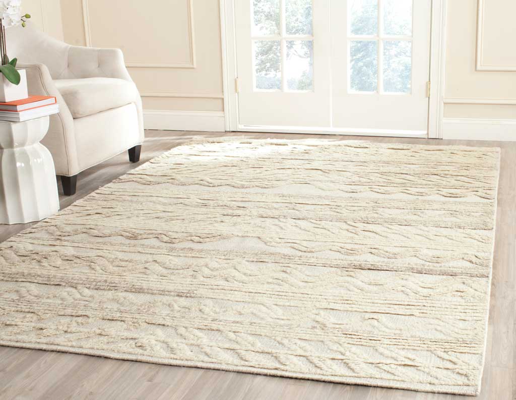 Textured ivory rug brings subtle pattern and warmth to a light-filled room